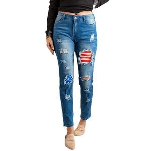 Women's high waist ripped jeans with American flag lining and vintage wash finish