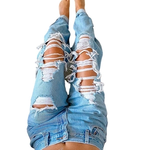 Women's summer high waisted light blue ripped denim jeans with distressed finish