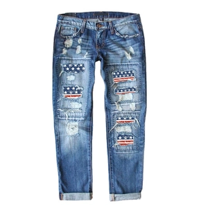 Classic American flag print ripped jeans in mid-blue denim with distressed patches