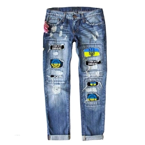 Blue mid-waist street jeans with I Stand With Ukraine patches and sunflower graphics