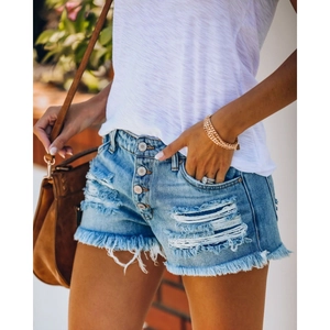 Light blue distressed denim shorts with frayed edges and button fly for a summer casual look