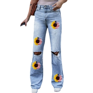 High-waisted flare jeans for women featuring sunflower and American flag patchwork details