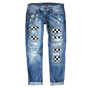 Classic blue distressed jeans with black and white checkerboard patchwork and ripped details