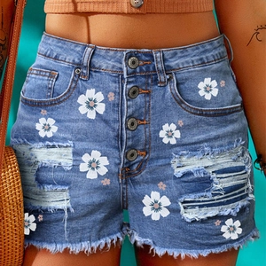 Women high waisted light blue denim shorts with daisy print and distressed ripped details
