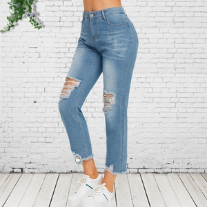Women's light blue high waist straight leg jeans with ripped knees and raw hems