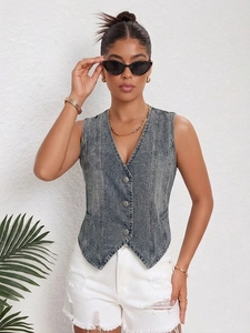Close-up of retro washed grey denim vest with metal buttons and V-neckline on a model
