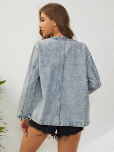Back view of a loose oversized light blue acid wash denim jacket with dropped shoulders