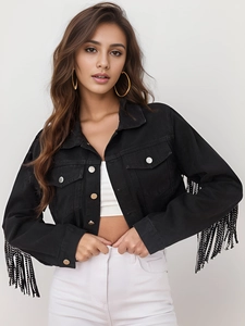 Close-up of black denim jacket with sparkling sequin fringe and metal buttons detail