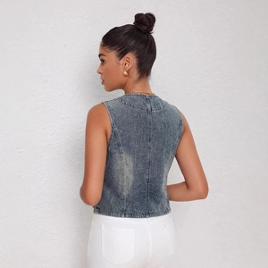 Women's vintage wash blue denim vest with slim fit cropped cut and structured back stitching