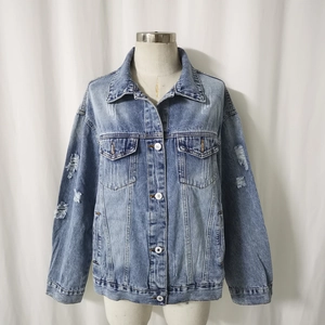 Vintage light blue distressed denim jacket with ripped holes and button closure