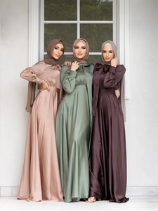 Three elegant satin Muslim dresses in pink, sage, and purple with matching hijabs