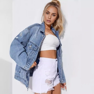 Women's oversized distressed blue denim jacket with ripped details and frayed hem
