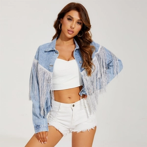 Women's light blue washed denim jacket with silver fringe detail and loose fit style