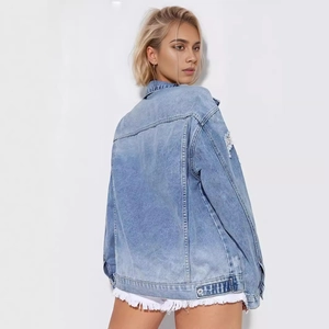 Oversized light blue distressed denim jacket for women with ripped details on back