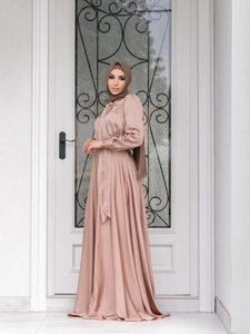 Detail of satin long sleeve modest maxi dress with matching hijab in champagne pink