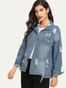 Close-up of light blue oversized denim jacket featuring distressed ripped detailing