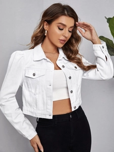 Detail of white cropped denim jacket featuring puff sleeves and silver metal buttons