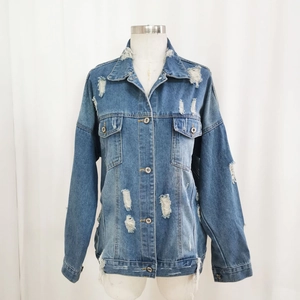 Classic blue distressed denim jacket with ripped details and a loose drop shoulder fit