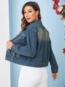 Rear view of classic blue denim jacket showing vintage wash and back stitching details