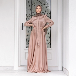 Elegant dusty pink satin Muslim dress with matching hijab featuring a tie-neck design