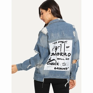 Distressed blue denim jacket with graffiti art patch on the back and ripped details