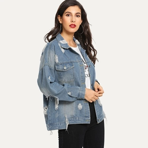Oversized distressed light blue denim jacket with vintage ripped details and fringe