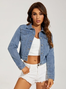 Detail of light blue cropped denim jacket featuring metal buttons and front chest pockets