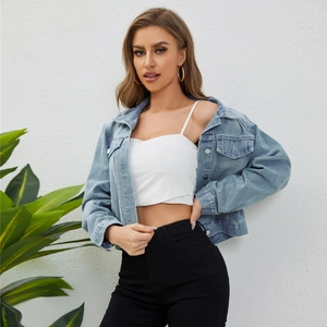 Women's light blue distressed short denim jacket with metal buttons and classic pockets
