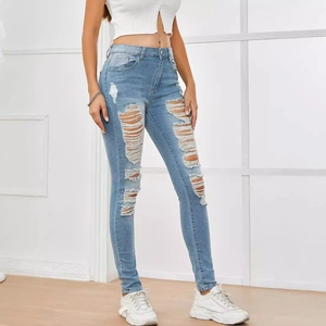 Slim fit high-waisted light blue distressed jeans with ripped details and frayed hems