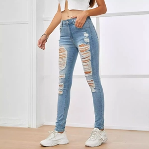 Women's high waist skinny jeans in light blue denim with distressed ripped details
