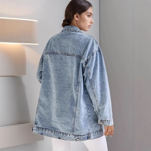 Women's light blue oversized denim jacket featuring drop shoulder and ripped details