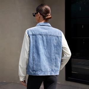 Women's denim jacket with corduroy patchwork sleeves and outdoor casual style back view