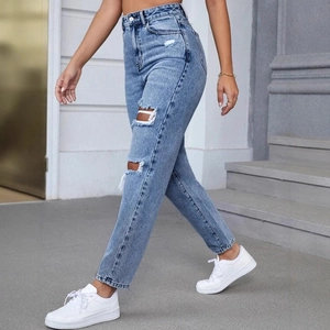 Women's high waist ripped jeans in light blue denim with a trendy straight leg fit