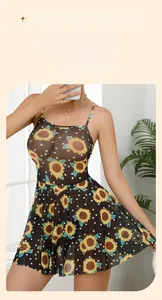 Detail of sheer black sunflower print lingerie slip with spaghetti straps and mesh fabric