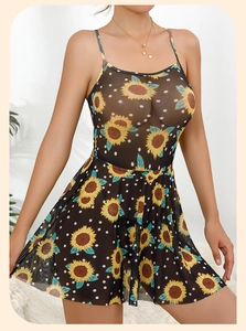 Detail of sheer black mesh mini dress with sunflower prints and delicate spaghetti straps