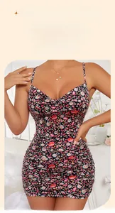 Detailed close-up of a slim-fit floral backless dress with a heart chain pendant detail