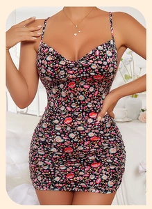 Detail of floral mini dress featuring ruched sides and a stylish cowl neck design