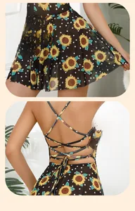 Detail of sunflower print pattern and back criss-cross lace-up straps on a black dress