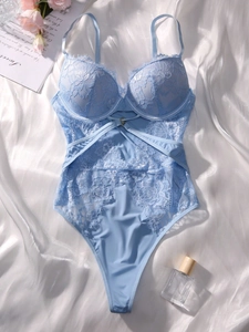 Close-up of light blue floral lace bodysuit with underwire support and cut-out details