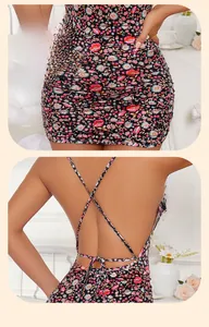Detail of floral backless mini dress featuring slim fit ruching and crisscross straps