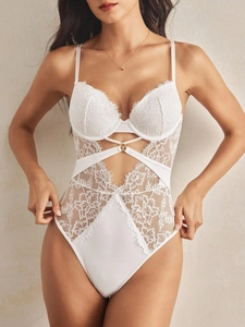 Close-up of white floral lace teddy bodysuit with underwire support and strappy detail