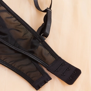 Elegant black lace bra set back view featuring adjustable straps and mesh fabric detail