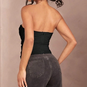 Sexy black strapless corset top with pleated fabric and back zipper for women