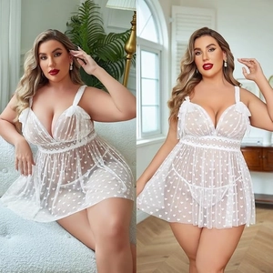 Detail view of plus size white mesh chemise with lace patchwork and heart patterns