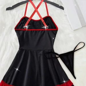 Sexy black and red nurse lingerie set with ruffled hem on white plush background