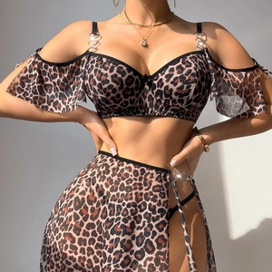 Three-piece leopard print lingerie set with metal rings and sheer wrap skirt