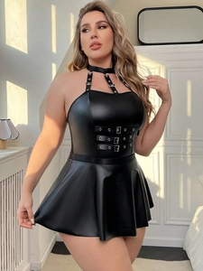 Detailed close-up of a black faux leather mini dress with metal chain neck halter straps