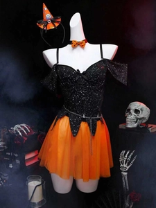 Detail of Halloween witch costume featuring a black sequin top and orange mesh skirt