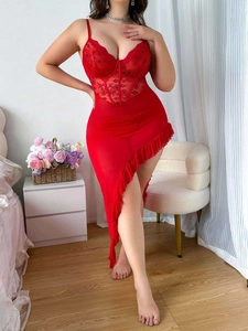Detailed view of red lace lingerie dress with black floral embroidery and mesh hem