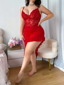 Close-up of red lace bodice with boning support and sheer mesh asymmetrical hemline